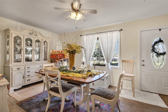 dining room featuring dark wood-type flooring and ceiling fan