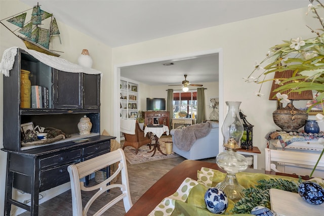 dining area featuring visible vents, wood finished floors, and a ceiling fan