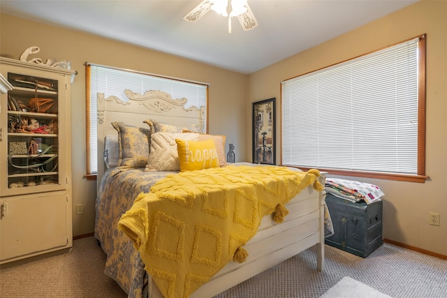bedroom featuring baseboards, carpet, and a ceiling fan