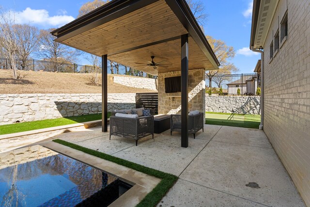 2432 Bellview Cir, Tyler, TX 75709 - fenced backyard with ceiling fan, a patio, and an outdoor living space