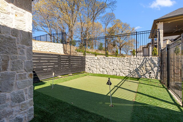 2432 Bellview Cir, Tyler, TX 75709 - fenced backyard with an area to practice putting