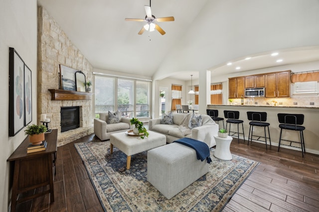 9721 Stripling Dr, Fort Worth, TX 76244 - living area with ceiling fan, high vaulted ceiling, a fireplace, dark wood-type flooring, and recessed lighting