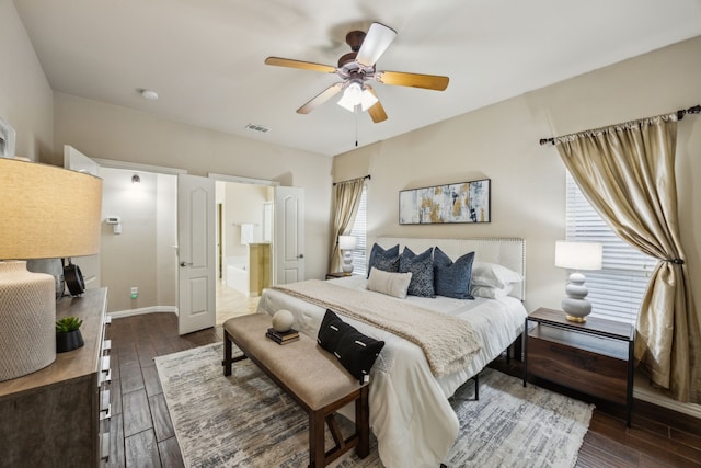 9721 Stripling Dr, Fort Worth, TX 76244 - bedroom with dark wood-style floors, a ceiling fan, baseboards, and ensuite bath