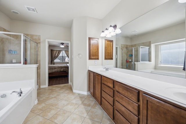 9721 Stripling Dr, Fort Worth, TX 76244 - ensuite bathroom with double vanity, a garden tub, a shower stall, and tile patterned flooring