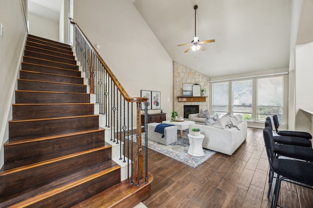 9721 Stripling Dr, Fort Worth, TX 76244 - living room featuring a ceiling fan, high vaulted ceiling, stairs, dark wood-style flooring, and a fireplace