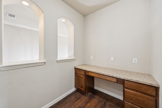 9721 Stripling Dr, Fort Worth, TX 76244 - unfurnished office featuring built in desk, baseboards, and dark wood-type flooring