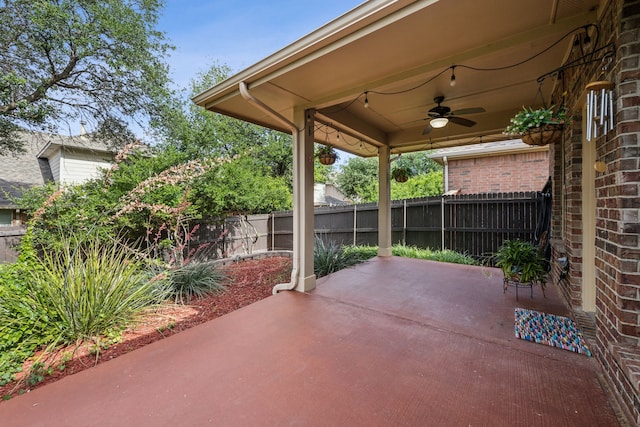 9721 Stripling Dr, Fort Worth, TX 76244 - fenced backyard featuring a ceiling fan and a patio area