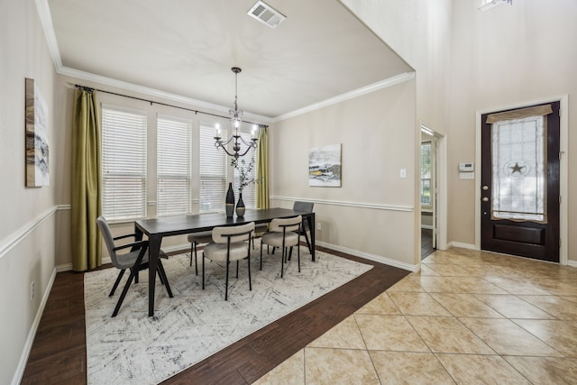 9721 Stripling Dr, Fort Worth, TX 76244 - dining room featuring a chandelier, ornamental molding, baseboards, and tile patterned floors