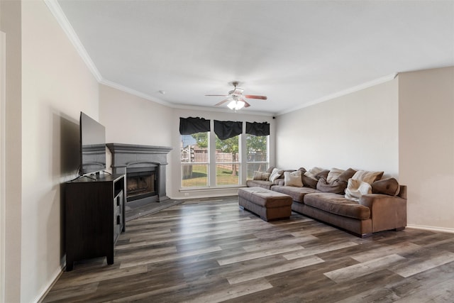 5532 Grayson Ridge Dr, Fort Worth, TX 76179 - living area featuring a ceiling fan, dark wood-type flooring, ornamental molding, and a fireplace with raised hearth