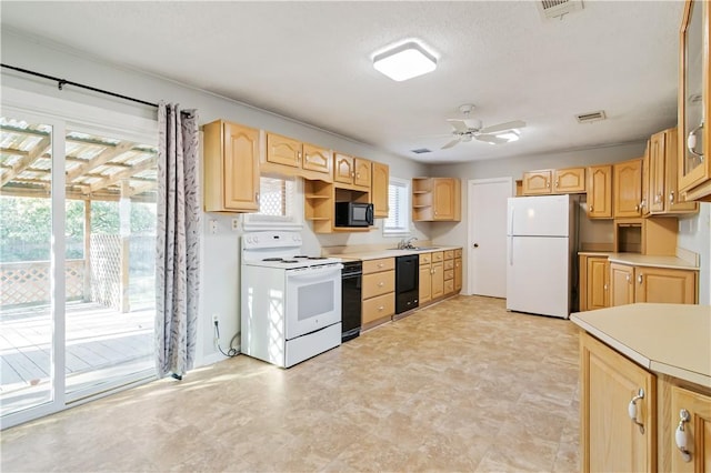 kitchen featuring a sink, open shelves, light brown cabinetry, visible vents, and black appliances