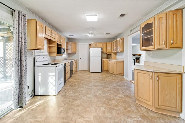 kitchen with white appliances, visible vents, a ceiling fan, light brown cabinets, and glass insert cabinets