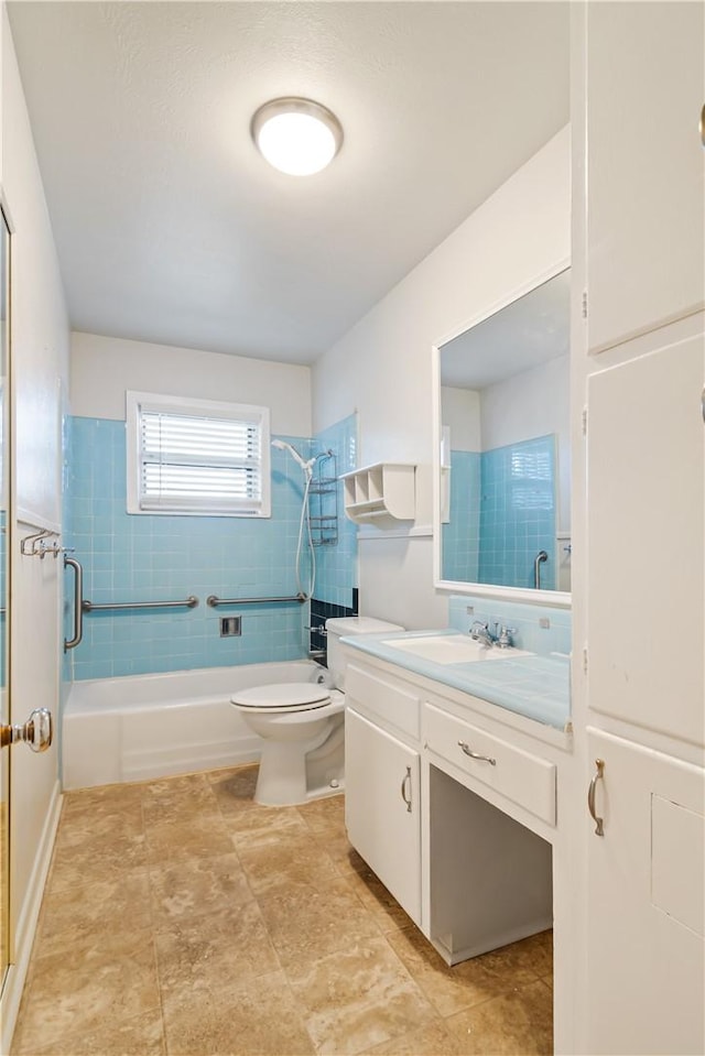 bathroom with shower / bath combination, toilet, and vanity