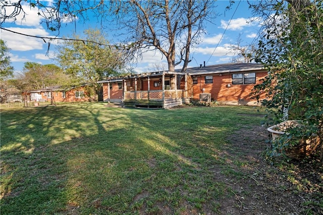 back of property with a yard