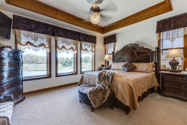1752 County Road 1450, Bonham, TX 75418 - carpeted bedroom featuring multiple windows, a tray ceiling, baseboards, and crown molding