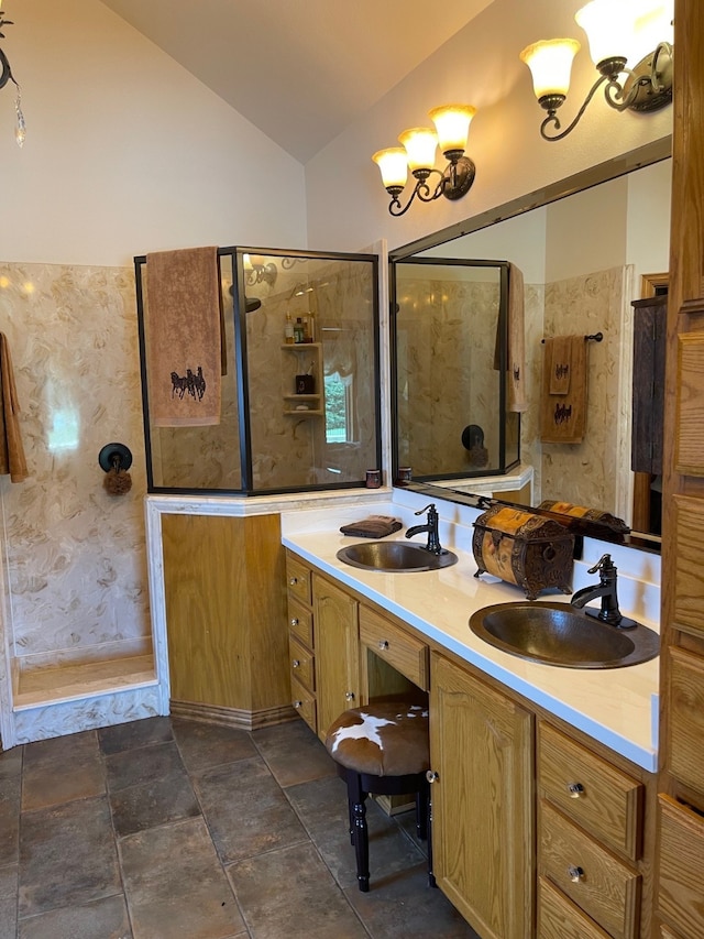 1752 County Road 1450, Bonham, TX 75418 - bathroom featuring lofted ceiling, a stall shower, and double vanity
