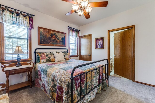 bedroom with carpet floors, ceiling fan, and multiple windows