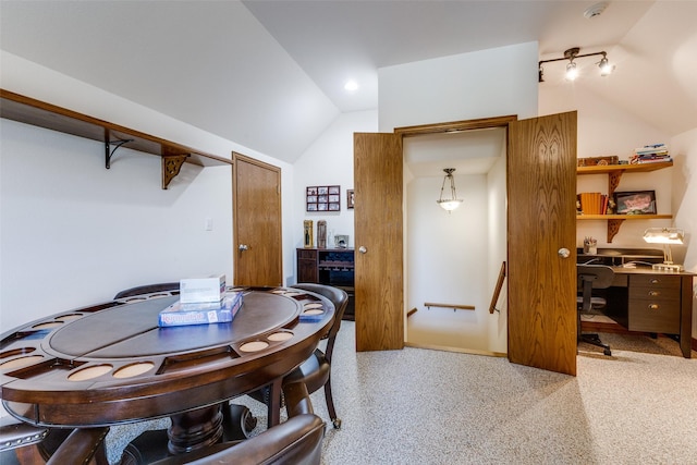 dining room featuring vaulted ceiling