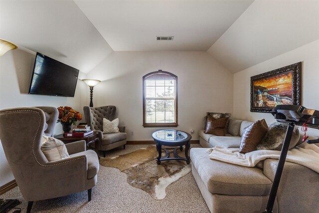 living room with carpet flooring, baseboards, visible vents, and lofted ceiling