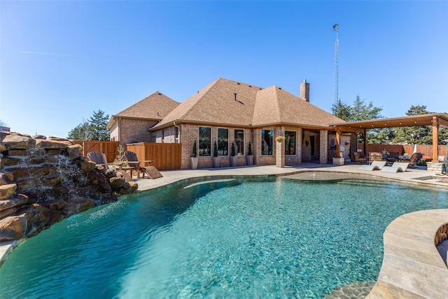 view of swimming pool featuring a fenced in pool, a fenced backyard, and a patio area