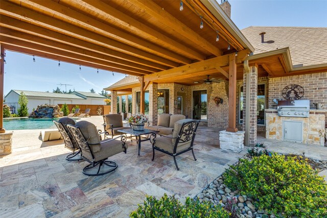 view of patio featuring ceiling fan, fence, an outdoor hangout area, a fenced in pool, and exterior kitchen