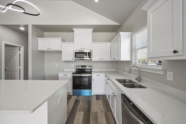 kitchen with white cabinets, a sink, stainless steel appliances, and dark wood-style floors