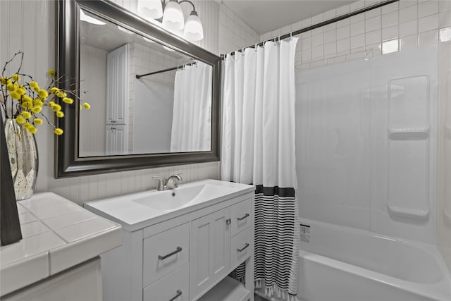 kitchen featuring light wood-style floors, appliances with stainless steel finishes, white cabinetry, visible vents, and tile countertops