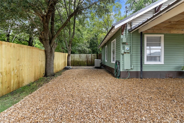 view of home's exterior featuring a fenced backyard and central AC unit