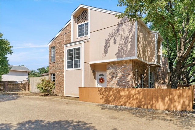 2411 Northlake Ct, Irving, TX 75038 - view of property with fence and brick siding