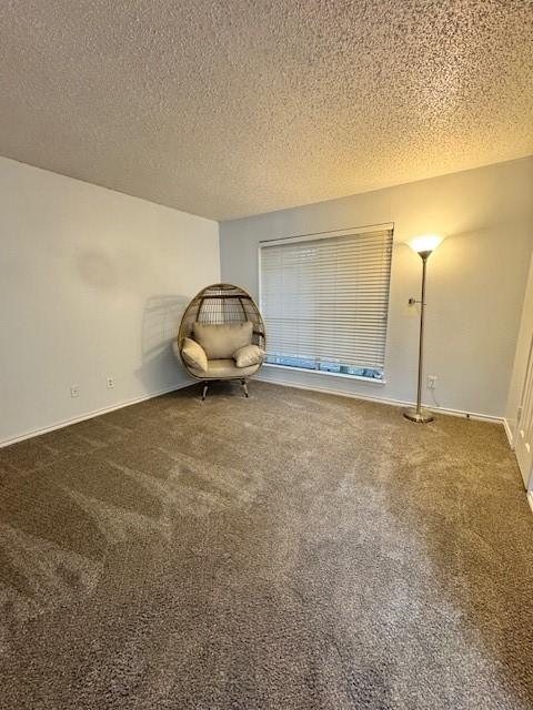 2411 Northlake Ct, Irving, TX 75038 - carpeted empty room featuring a textured ceiling and baseboards
