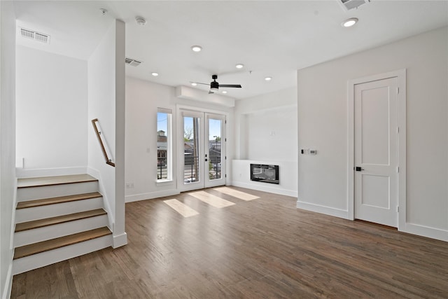 1804 Ripley St Unit 105, Dallas, TX 75204 - unfurnished living room featuring recessed lighting, wood finished floors, baseboards, and stairs