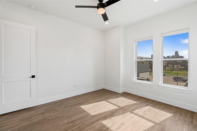 1804 Ripley St Unit 105, Dallas, TX 75204 - spare room with baseboards, wood finished floors, a ceiling fan, and recessed lighting