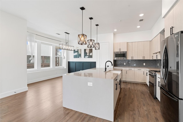 1804 Ripley St Unit 105, Dallas, TX 75204 - kitchen featuring appliances with stainless steel finishes, light brown cabinetry, light countertops, backsplash, and dark wood-type flooring