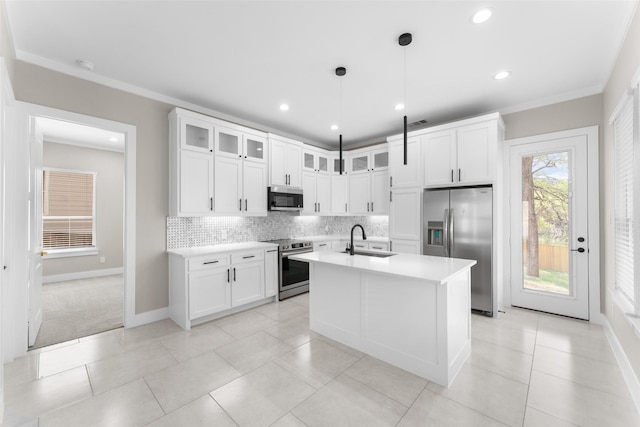 2111 Brookhaven Dr, Dallas, TX 75224 - kitchen with light countertops, a sink, white cabinetry, stainless steel appliances, and decorative backsplash