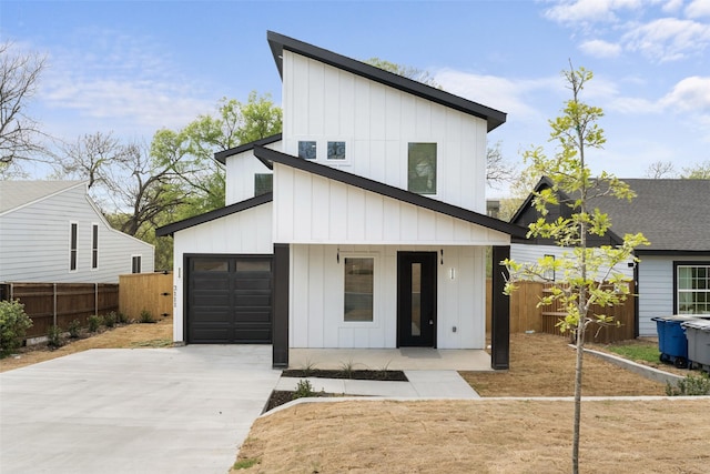 2111 Brookhaven Dr, Dallas, TX 75224 - view of front facade featuring driveway, covered porch, fence, and board and batten siding