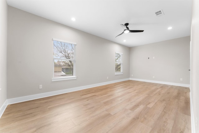 2111 Brookhaven Dr, Dallas, TX 75224 - unfurnished room with baseboards, visible vents, a ceiling fan, and light wood finished floors