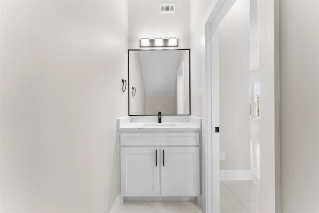 2111 Brookhaven Dr, Dallas, TX 75224 - bathroom with baseboards, visible vents, tile patterned flooring, and vanity