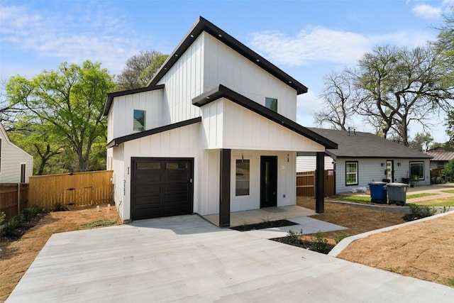 2111 Brookhaven Dr, Dallas, TX 75224 - modern inspired farmhouse with driveway, an attached garage, fence, and board and batten siding