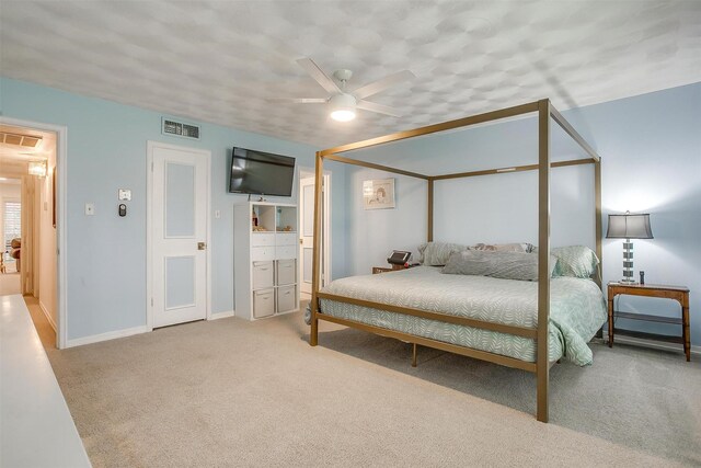 bedroom with baseboards, visible vents, ceiling fan, and carpet flooring