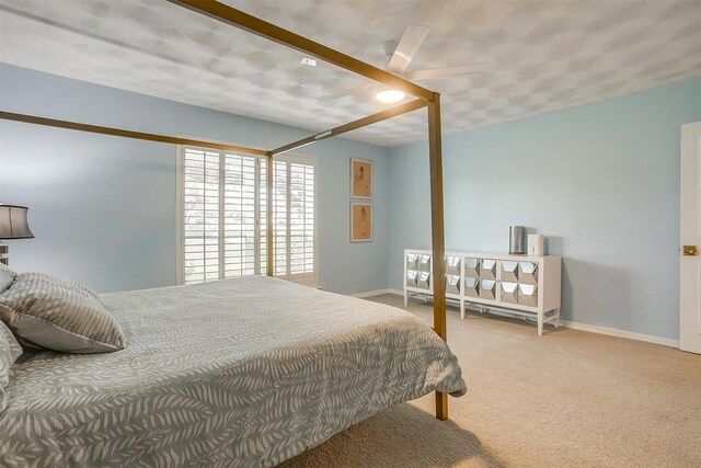 carpeted bedroom with baseboards