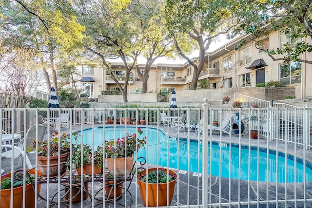 community pool featuring fence