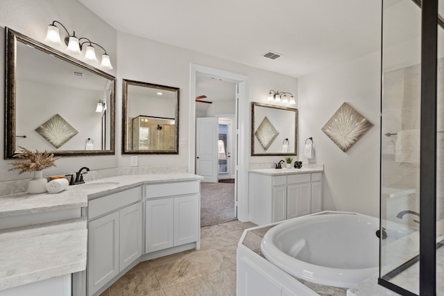 15664 Wild Cherry Ln, Fort Worth, TX 76262 - full bathroom featuring a garden tub and two vanities