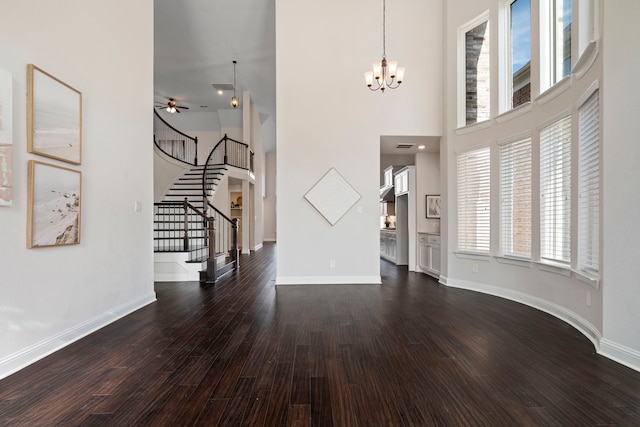 15664 Wild Cherry Ln, Fort Worth, TX 76262 - unfurnished living room with a chandelier, dark wood-style floors, stairway, a high ceiling, and ceiling fan