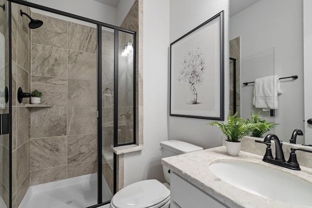 15664 Wild Cherry Ln, Fort Worth, TX 76262 - bathroom featuring vanity, a shower stall, and toilet