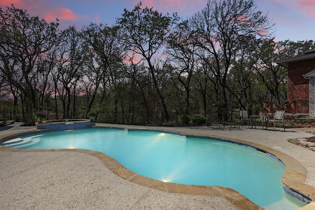 3713 Hidden Trl, Flower Mound, TX 75022 - pool at dusk featuring a patio and a pool with connected hot tub