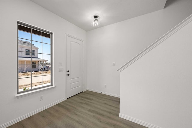 2412 Bulin Dr, Mansfield, TX 76063 - foyer with healthy amount of natural light, wood finished floors, and baseboards