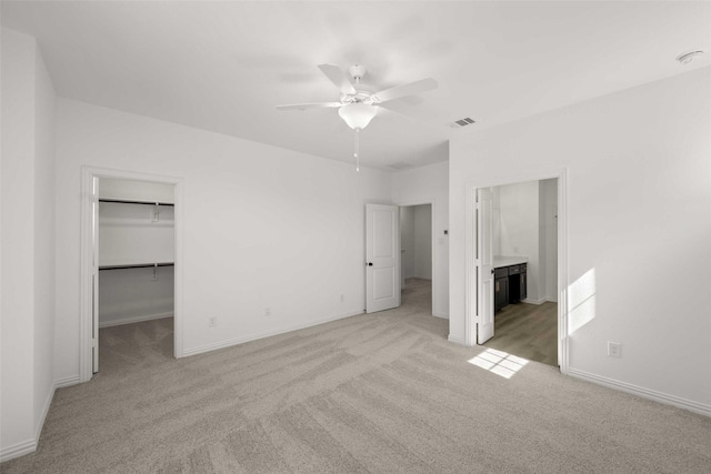 2412 Bulin Dr, Mansfield, TX 76063 - unfurnished bedroom with light carpet, a walk in closet, and baseboards