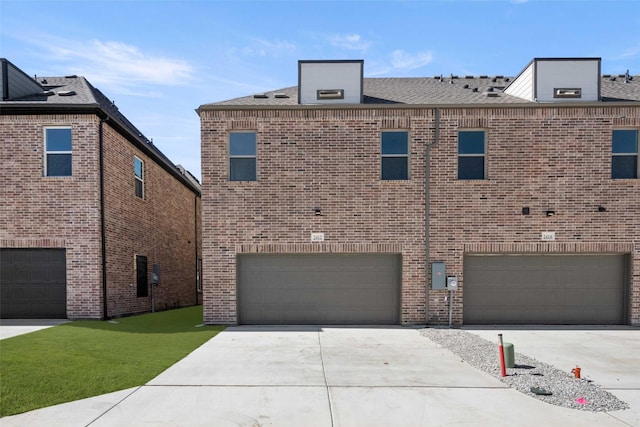 2412 Bulin Dr, Mansfield, TX 76063 - view of front of home featuring a garage, concrete driveway, and brick siding