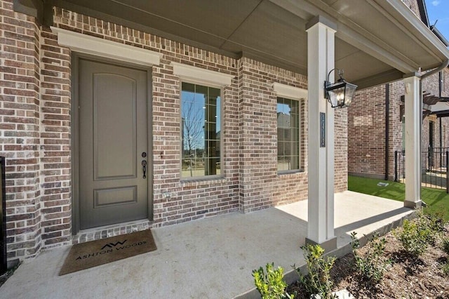 2412 Bulin Dr, Mansfield, TX 76063 - doorway to property with brick siding and a porch