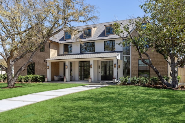 view of front of house featuring stucco siding, a front lawn, and a porch