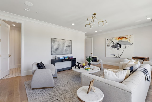 living area with light wood finished floors, baseboards, recessed lighting, and ornamental molding